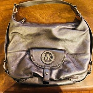Michael Kors silver leather purse.